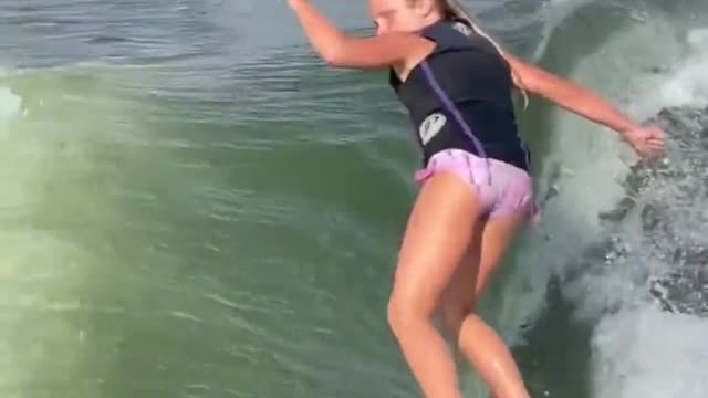 She's only nine years old, surfing