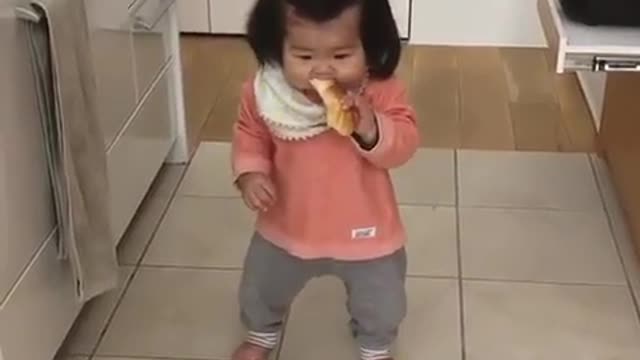 Baby Talia Hiding in Kitchen Eating Sandwitch Behind her Mother