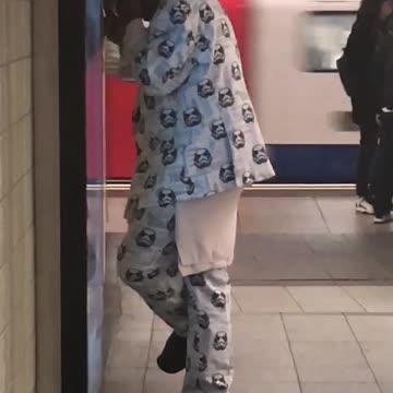 Man in black and white suite with pattern