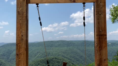 Kissing Couple Slowly Fall From Heavenly Swing