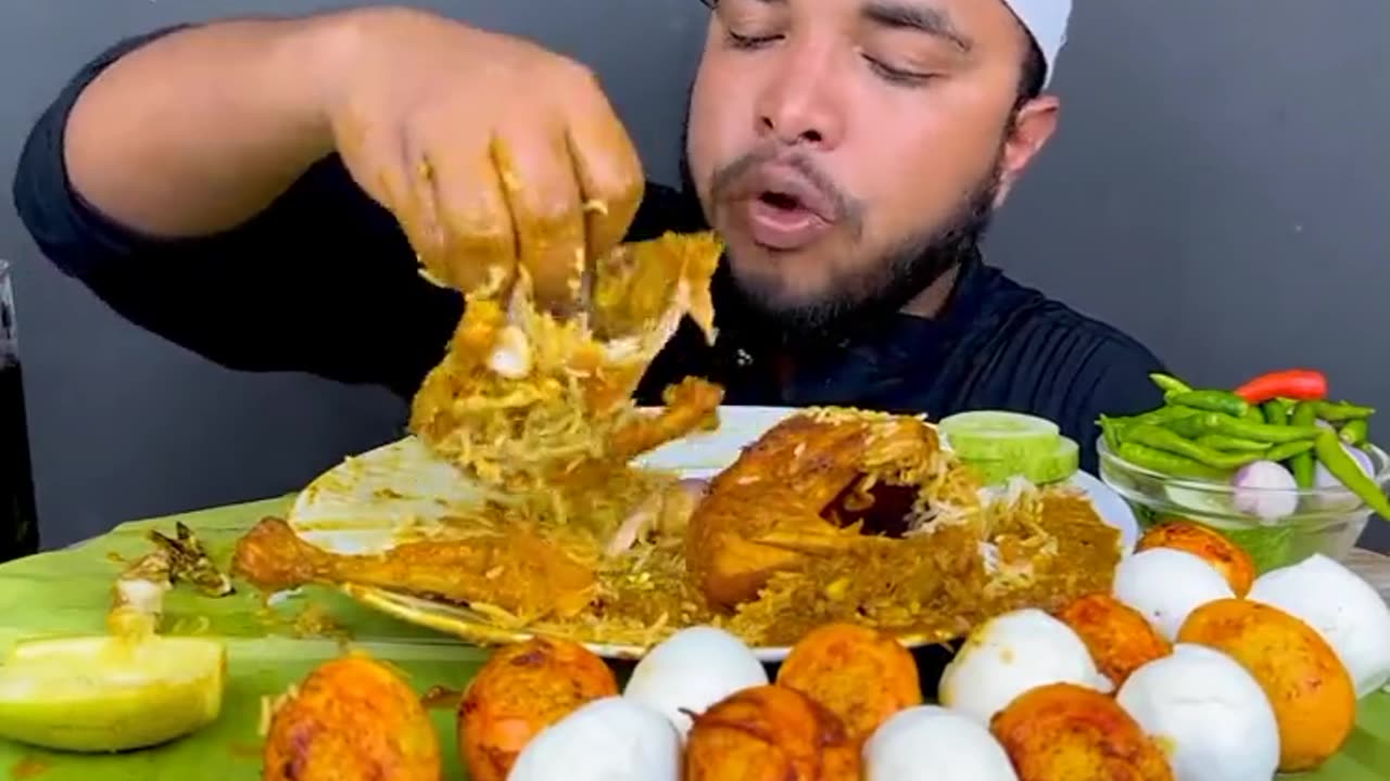 Full chiken curry and eggs with rice eating show