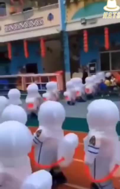 CHILD ABUSE Children in China wearing full Hazmat suits in schools