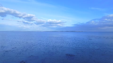 Two boats anchored off the shore