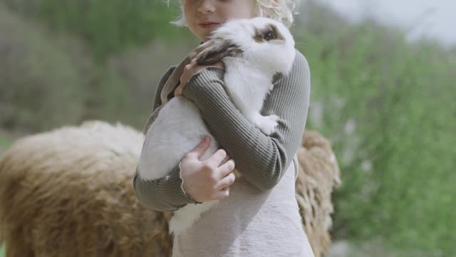 kid-holding-a-rabbit