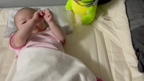 Baby playing with the doll