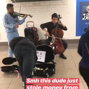 Homeless guy takes some money out of case of kids performing subway