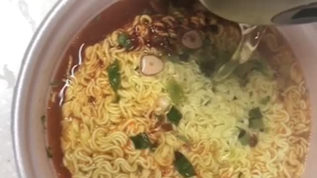 Video of pouring water in cup noodles