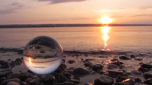 Beautiful Sunset at the beach with a ball