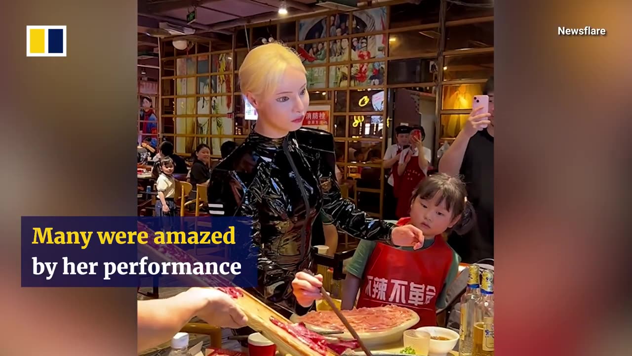 Robot-dancing waitress shocks diners in China.mp4