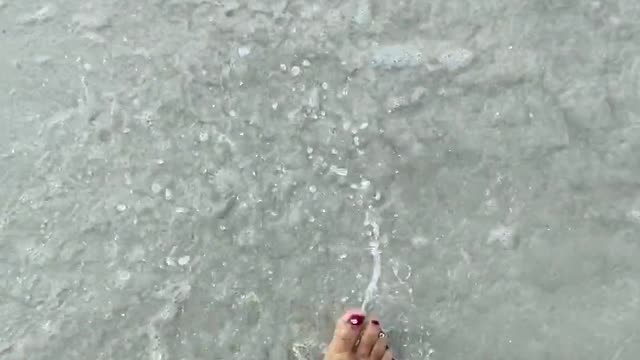 Walking bare foot on the sand