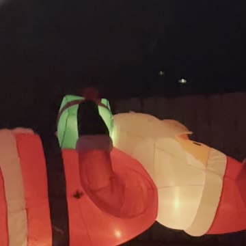 Santa Clause skating on slippery ground ground