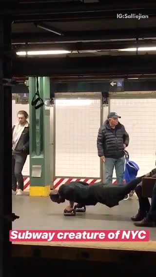 Man does push ups off bench with spinning handle at subway station