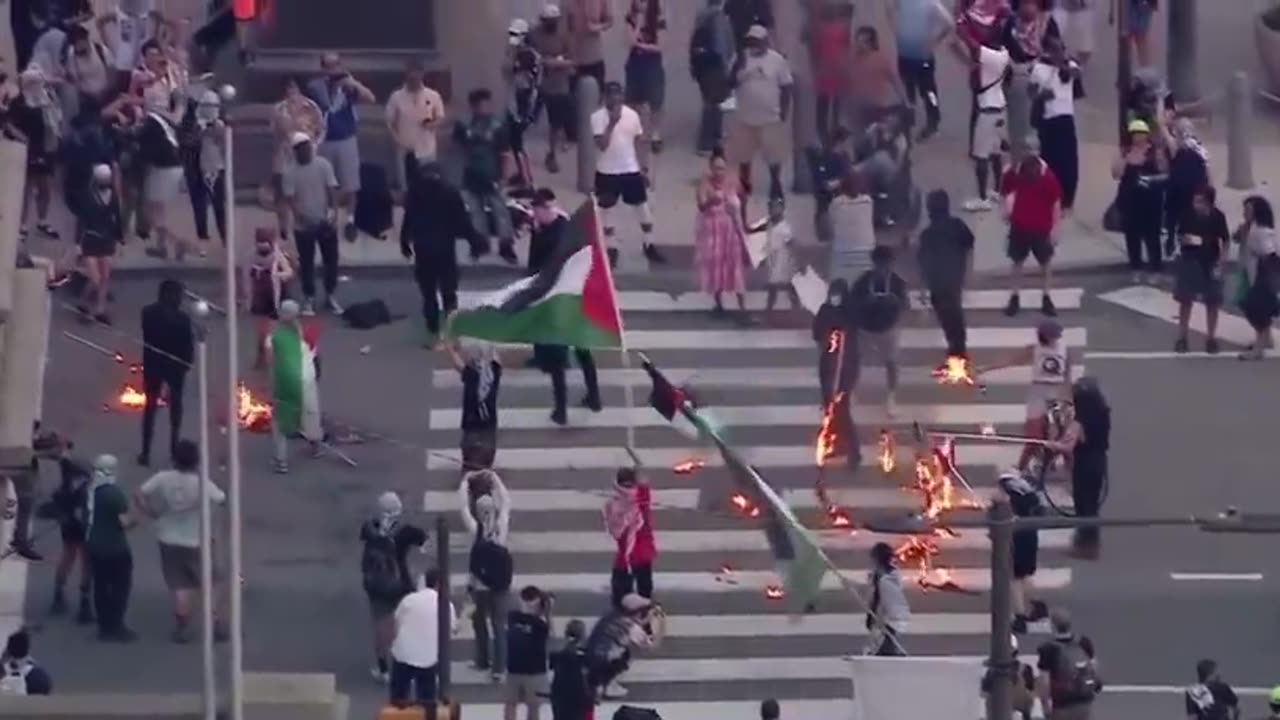 July 4th: Pro-Palestine protesters light American Flags on fire outside City Hall in Philadelphia