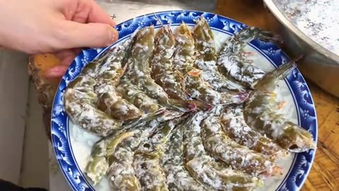 A serving of fried shrimps from the Typhoon Shelter costs hundreds of yuan in a restaurant