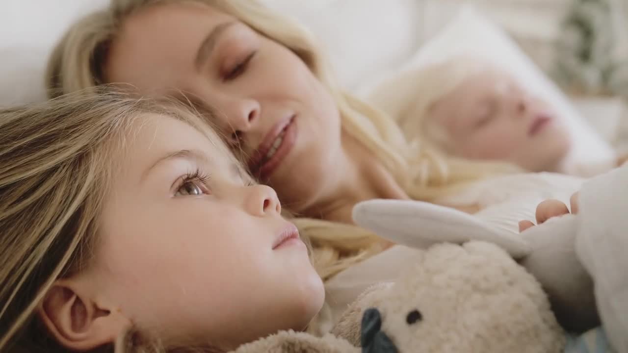 Mother enjoying loving moments with her two kids