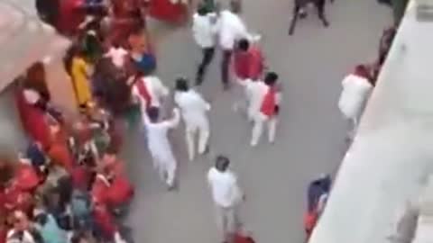 Wedding on streets interrupted by bull fight