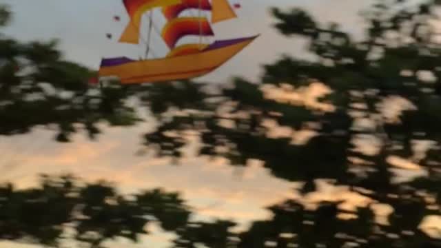 Motorcycle Passenger Flies Pirate Kite