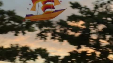 Motorcycle Passenger Flies Pirate Kite