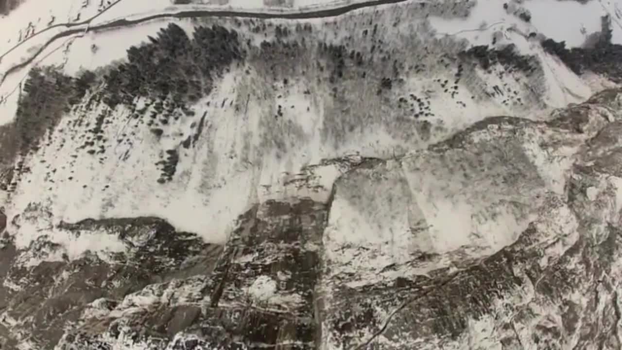 Intense POV footage of epic cliff dive in the Swiss Alps