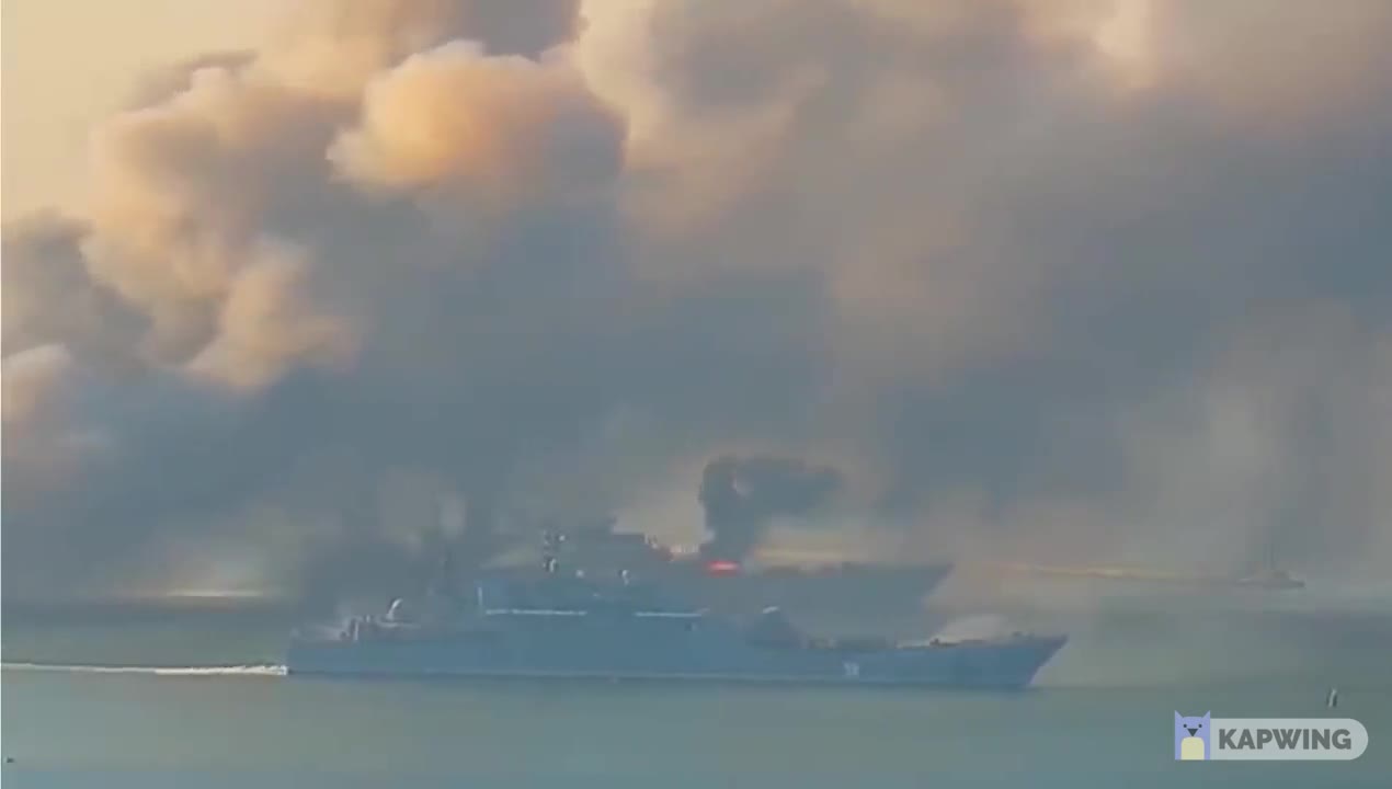 Russian warship on fire port of Berdyansk