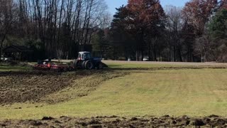 Allis Chalmers chisel plow tears up sod hay field