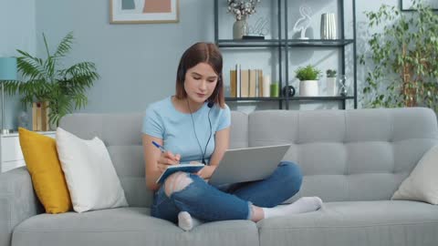 Middle aged woman wearing wireless headphones