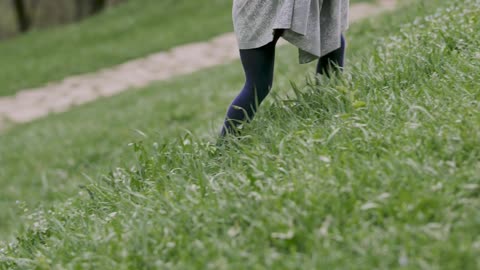 a-kid-walking-in-grassland