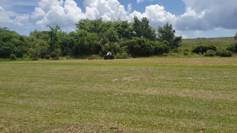 Michelle Cutting Grass at ET Section