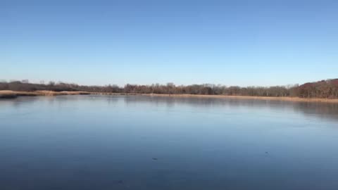 Skipping Rocks on Frozen Lake Wisconsin