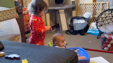 Big Sister Brushes Baby Brothers Hair