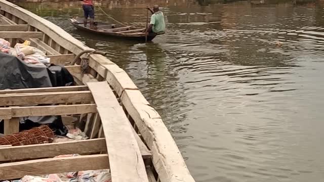 Casting net on a canoe