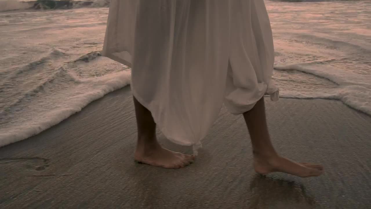 Feet walking on the beach