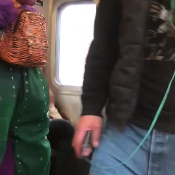 Person spinning in green alien dragon outfit