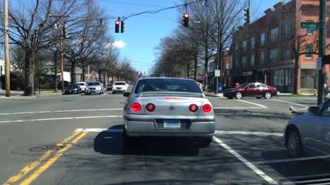 Teens on Bikes Running Red Lights And Doing Wheelies
