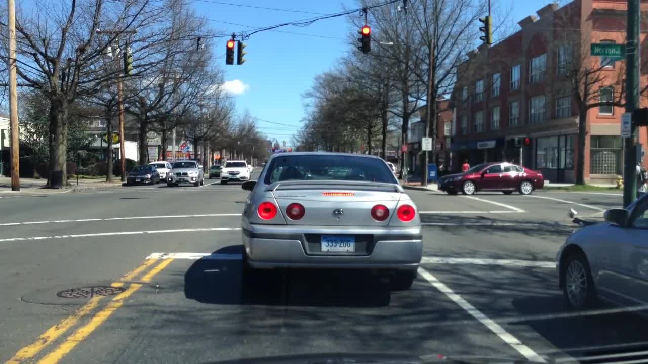 Teens on Bikes Running Red Lights And Doing Wheelies