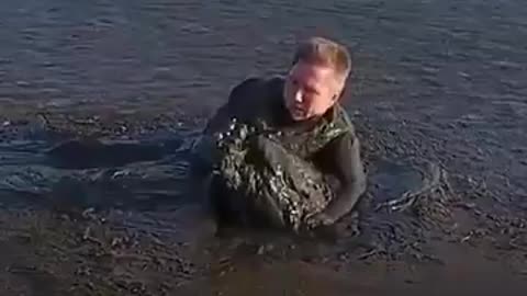 Faith In Humanity Restored - Man Saves Bird Out Of Mud