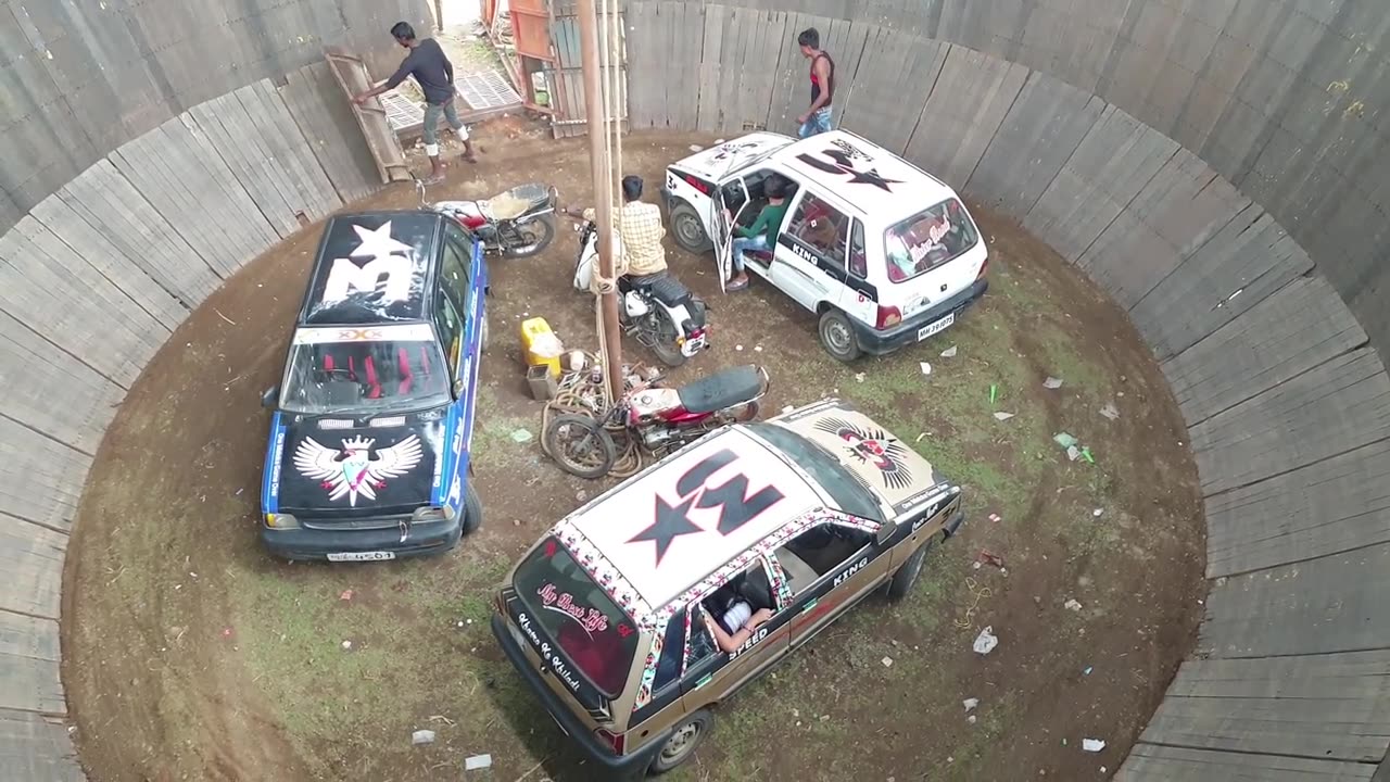 Indian girl and boys car stunt on well of death