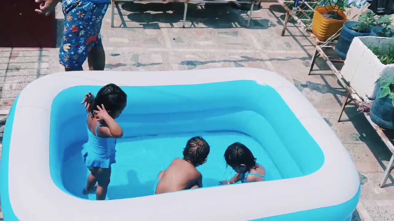 Triplets baby swimming, enjoying, happy mood