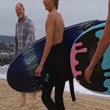 Surfers throw a Shaka to The Captain.
