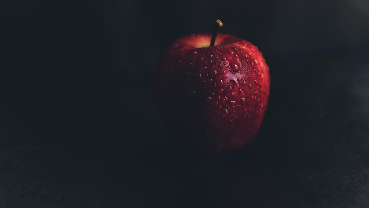 A Red Apple with Water Drops