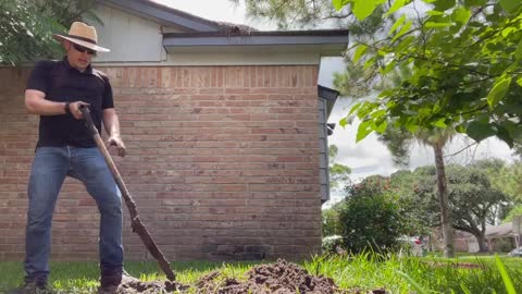 Digging a drainage ditch