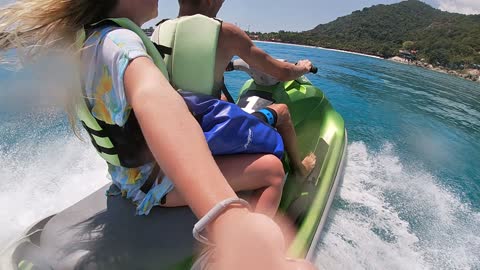 Ride on jet sky. Full moon beach. funny.