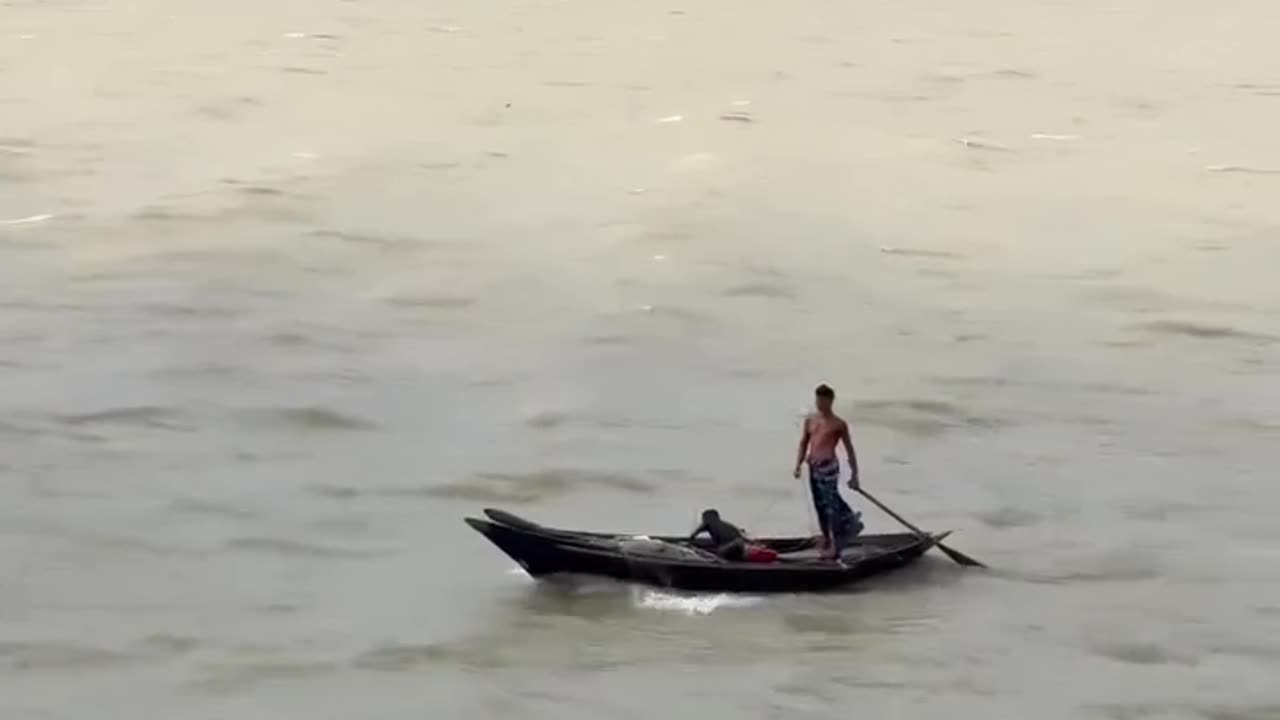 Fathers and his son in the middle of the river
