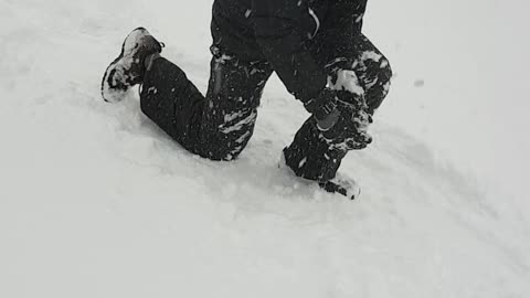 MAN SWIMMING THROUGH SNOW