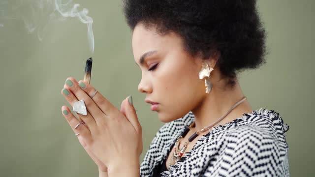 Meditation time in the morning , woman using incense