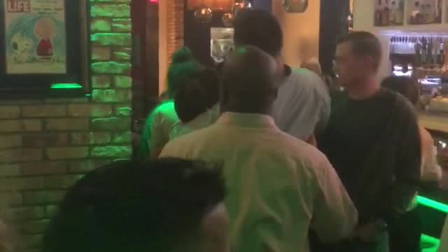 Man carried off bar stool at bar