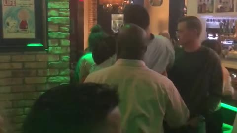 Man carried off bar stool at bar