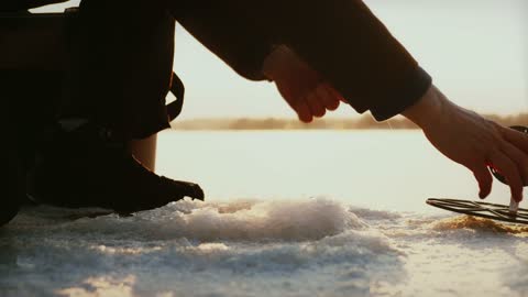 CATCHING A FISH PIKE UNDER ICE