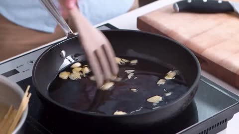 After the pan is hot, pour in the olive oil.