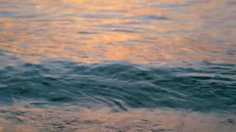 Sea Waves Under Sunset